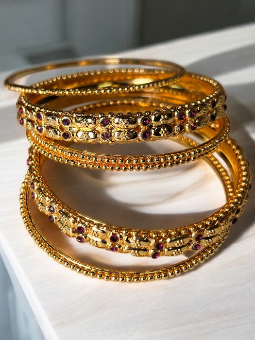 RegalGlow Gold Bangles Set with Sapphire Accents – 4pcs