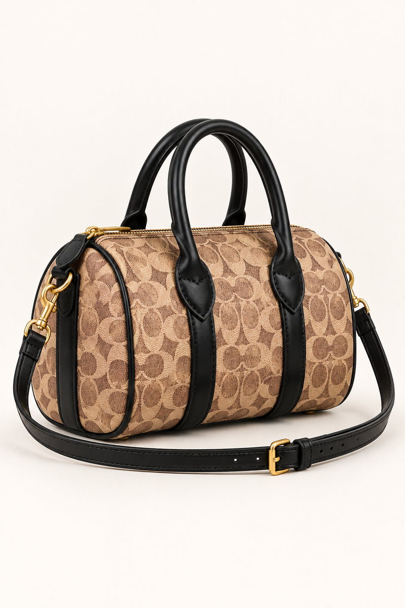 Coach monogram mini barrel bag side view