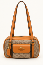 Coach monogram rounded shoulder bag in Brown