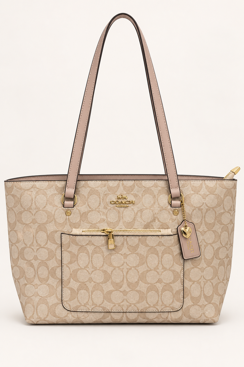 Light beige Coach-branded replica monogram everyday tote bag with taupe straps and front zip pocket